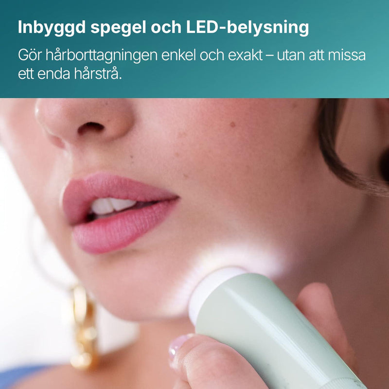 Närbild av Silky Planet ansiktshårborttagare som används vid hakan, med inbyggd spegel och LED-belysning.