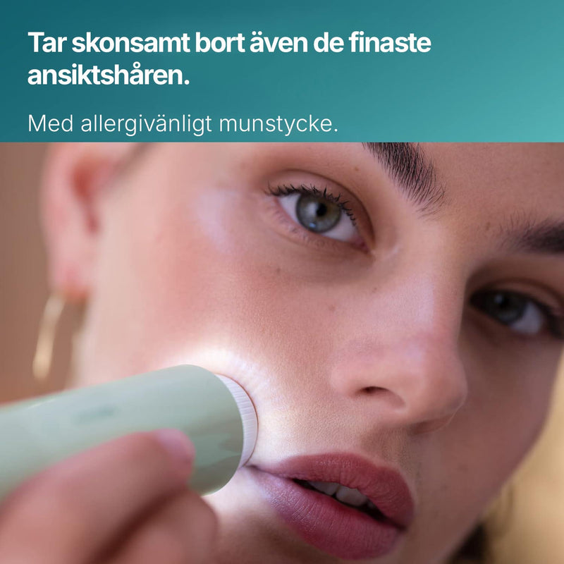 Närbild av Silky Planet ansiktshårborttagare som används på kinden med allergivänligt munstycke.
