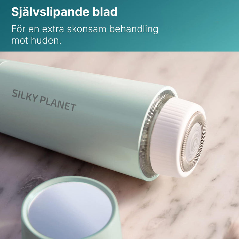 Närbild av det självslipande bladet på Silky Planet ansiktshårborttagare på marmorunderlag.