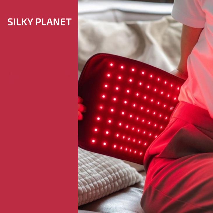 Silky Planet infrarött terapibälte med lysande LED-panel mot rygg, banderoll med varumärkesnamn