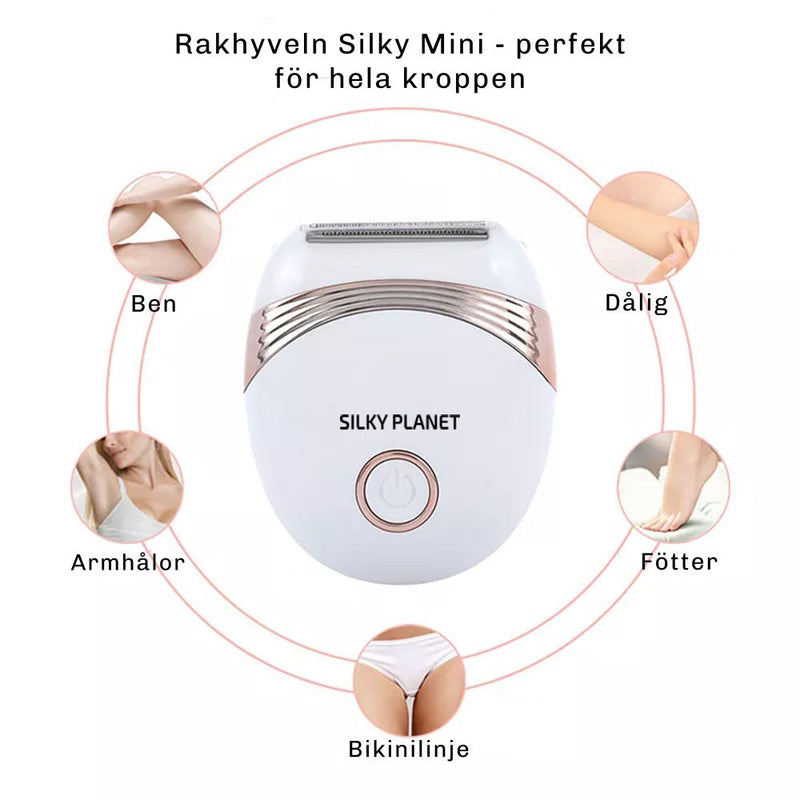 Närbild på Silky Planet rakapparatens strömknapp och rakblad i rostfritt stål.